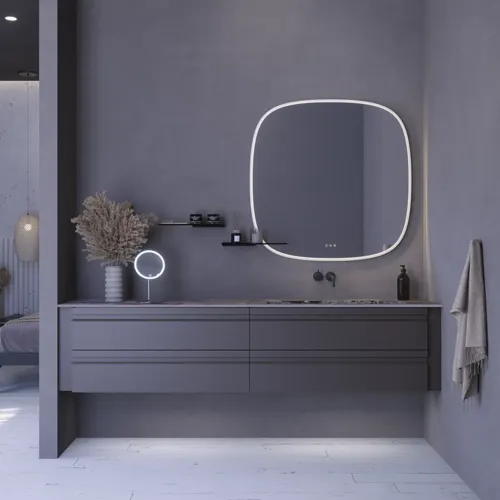 Stort badeværelse inspiration med grå vaskeskab med integreret greb, stilfuld sidestillet håndvask, firkantet spejl med afrundede hjørner, vægge i beton look samt rå materialer giver et urban udtryk