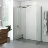 Stort badeværelse inspiration med vaskeskab med dyb bundskuffe i brun eg, smuk dobbeltvask, elegant spejlskab med integreret lys og walk-in brusebad med satin detaljer, store lyse fliser giver et lyst og moderne udtryk.