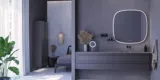 Stort badeværelse inspiration med grå vaskeskab med integreret greb, stilfuld sidestillet håndvask, firkantet spejl med afrundede hjørner, vægge i beton look samt rå materialer giver et urban udtryk